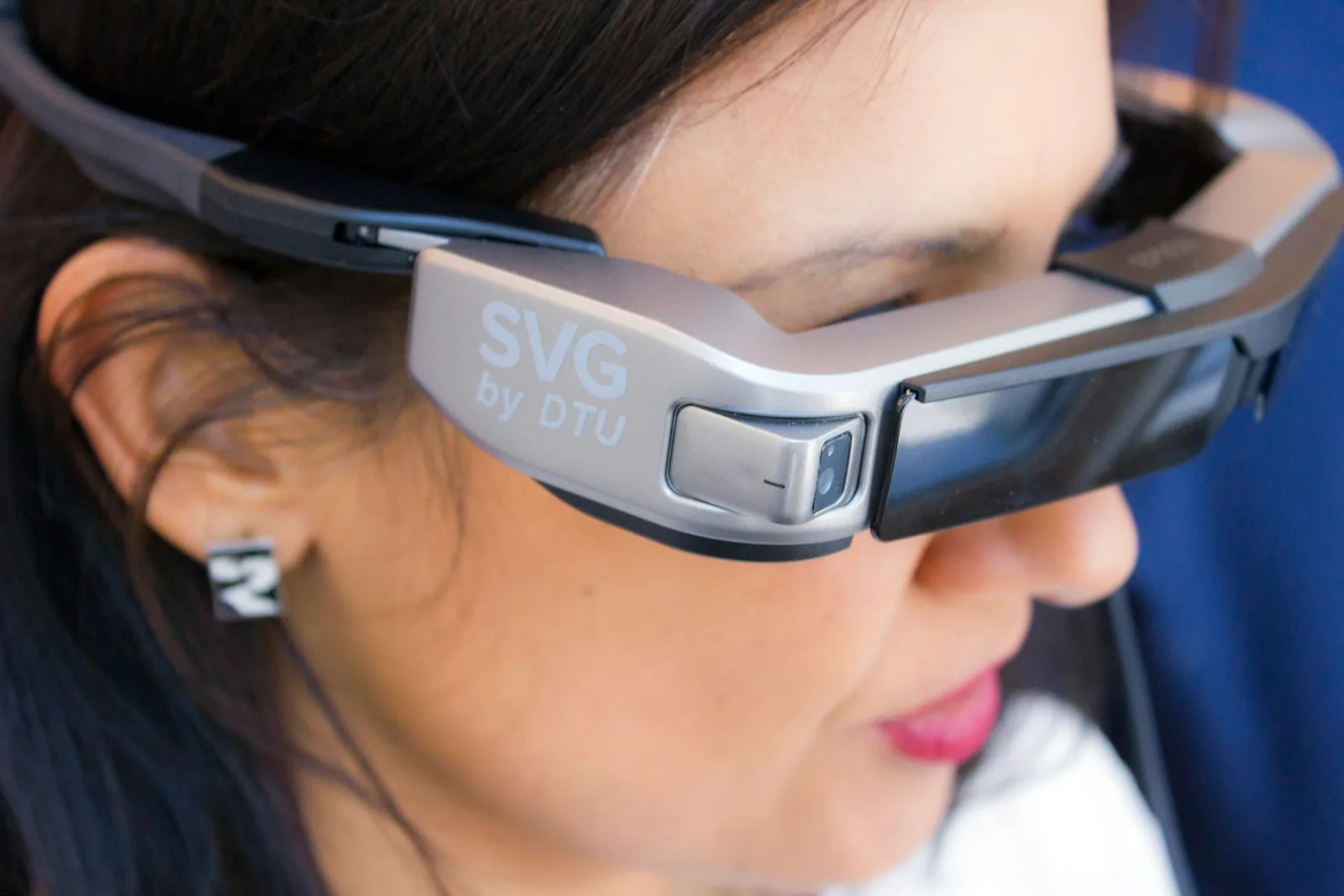 Woman wearing slim smart glasses with a built-in display